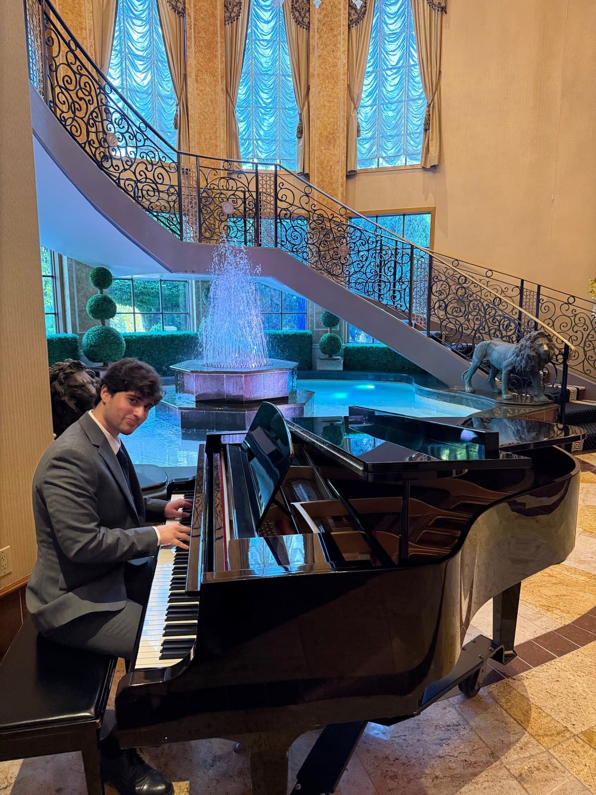 Omar playing a grand piano